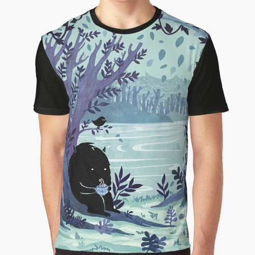 A watercolor illustration of a cozy nature scene with a cup of tea, trees, and woodland creatures on a graphic t-shirt.