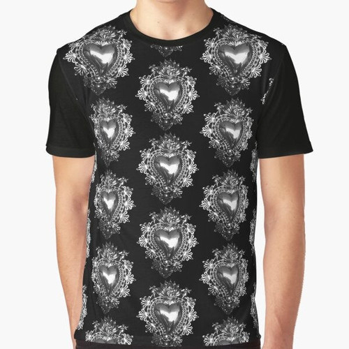 A t-shirt featuring a handmade silver sacred heart Mexican milagrito tin decoration, a unique piece of Mexican folk art.