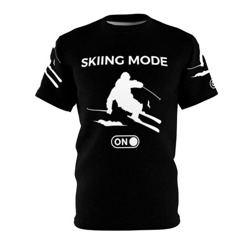 A person wearing a white t-shirt with a skiing-themed design, featuring the text "Skiing Mode On" and a skier silhouette.