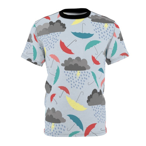 Vibrant t-shirt featuring a whimsical rainy day pattern with umbrellas, clouds, and lightning bolts, perfect for children.