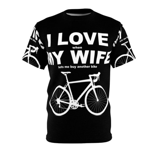 A casual, humorous t-shirt design featuring a playful pun about a wife allowing her husband to go biking.
