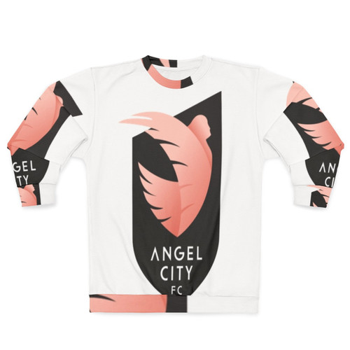 Woman wearing an Angel City Soccer sweatshirt with a football design