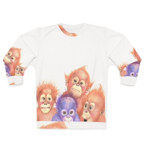 Adorable baby orangutan on orange and purple sweatshirt