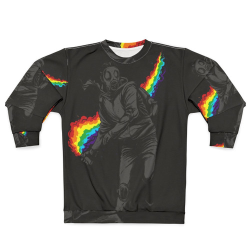 Colorful sweatshirt design with text "No More Tear Gas" against a background of political protest imagery