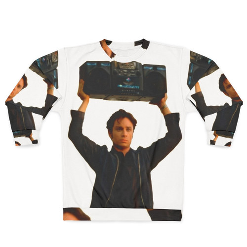 Chris Kattan holding a boombox on a retro-inspired sweatshirt