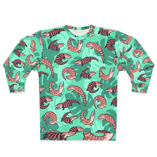 Vibrant blue tongue skink illustration on a cozy sweatshirt
