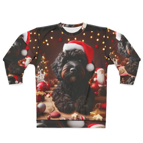 Black cockapoo dog wearing a Santa hat on a Christmas sweatshirt