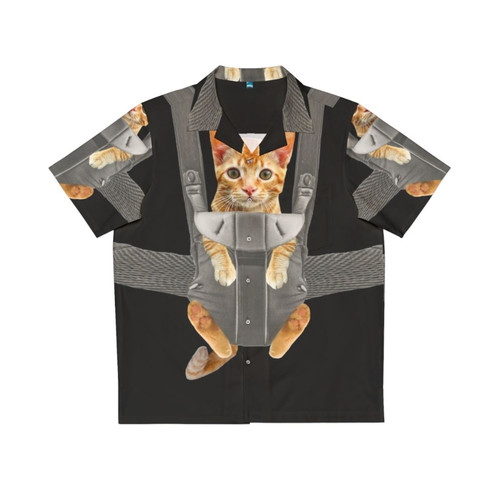 Monty the cat wearing a Hawaiian shirt while sitting in a baby carrier