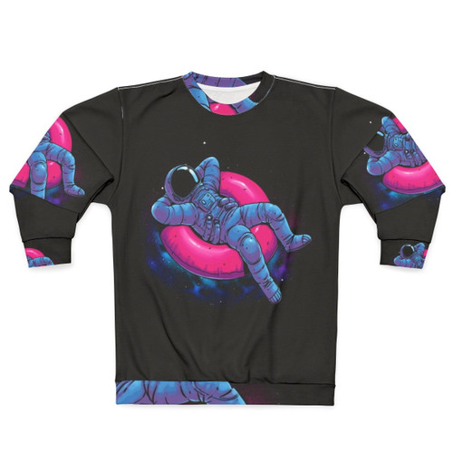Floating Dream Sweatshirt featuring an astronaut floating in space amidst a colorful nebula