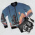 A rusty-colored bomber jacket with a printed weather forecast and meteorology-inspired design - Flat lay