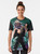 Vintage-inspired graphic t-shirt featuring Robby the Robot and Bettie Page in a retro 1950s sci-fi style. - Women