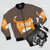 An orange tabby cat wearing a stylish bomber jacket - Flat lay