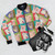 A bomber jacket featuring four iconic meme cats in a pop art style, representing the "Four Meme Cats of the Apocalypse". - Flat lay
