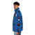 Blue puffer jacket with red and blue geometric shapes inspired by the artwork of Joan Miro - men side left