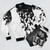 Shark-themed bomber jacket featuring various shark species in a vibrant, nature-inspired design - Flat lay