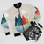 Colorful and geometric landscape bomber jacket with rainbow, green, red, yellow, orange, blue, purple, and pink colors - Flat lay