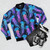 Luminescent jellyfish in an ombre rainbow pattern on a navy blue bomber jacket - Flat lay