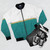 Fashionable urban bomber jacket with abstract teal and gold design - Flat lay