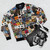 Tapestry bomber jacket featuring collages of iconic rock album covers - Flat lay