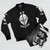 Vintage bomber jacket with a design featuring an ape or monkey, representing the evolution of mankind - Flat lay