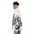 Iron Giant puffer jacket with a pointillistic design featuring the beloved robot hero in a forest setting - men side left