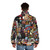 A puffer jacket featuring a collage of music album covers and band logos - men back