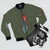 Grunge style bomber jacket featuring the insignia of the 237º Squadriglia, 96º Gruppo Regia Aeronautica Lecce unit. - Flat lay
