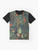 Whimsical and enchanting graphic t-shirt featuring a forest-inspired pattern with fairytale elements like a fox, trees, and floral designs in shades of green. - Flat lay