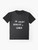 A white t-shirt with the text "You wouldn't download a gender" in white font, a playful anti-piracy message with a non-binary theme. - Flat lay