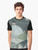 Cozy winter landscape graphic t-shirt featuring a village nestled in hills under a starry night sky - Men