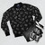 Hololive Korone-san's new bomber jacket with a camisole pattern featuring a dog, bone, and other elements from her character design. - Flat lay