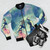 Kingdom Hearts-inspired bomber jacket with wayfinder symbol, characters, and colorful space design - Flat lay