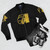 Studio 54 Retro Disco Bomber Jacket, featuring a gold and black design with a studio 54 and disco music theme. - Flat lay
