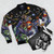Vintage-style Transformers G1 bomber jacket with Autobots and Decepticons characters - Flat lay