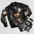 Model wearing a bomber jacket with a portrait of Captain Jack Sparrow from the Pirates of the Caribbean movie franchise. - Flat lay