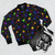Retro 90s-style bomber jacket with a bright confetti pattern that glows under blacklight - Flat lay