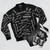 Black bomber jacket with Robbie Williams song titles printed on it - Flat lay