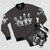 A7X bomber jacket featuring a graphic design with music symbols and skulls - Flat lay