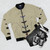 Bomber jacket featuring illustrations of Australian native birds including wedge-tailed eagle, rosella, fairy-wren, magpie, and kookaburra. - Flat lay