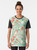 A vibrant graphic t-shirt featuring various Christmas baking elements like cookies, cupcakes, and candy canes. - Women