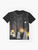 Spooky ghost parade graphic t-shirt with full moon, haunted forest, and glowing lanterns - Flat lay