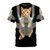 An adorable orange tabby cat named Monty sitting comfortably in a baby carrier on a t-shirt.