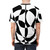 Model wearing an abstract black and white geometric pattern t-shirt with a 1960s mod style - men back