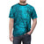 Photograph of a t-shirt featuring a night sky with stars, nebula, and silhouetted trees in a teal and black color palette. - men front
