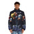Astronaut in a colorful space travel puffer jacket floating among planets and stars - men front