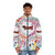 A colorful puffer jacket for dachshunds, featuring a whimsical nature-inspired design with flowers and birds. - men front