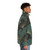 A puffer jacket featuring vibrant ginkgo biloba leaves in green and yellow, a nature-inspired design. - men side right