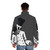 Skeleton chef wearing a grey puffer jacket, standing in a kitchen - men back