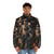 A puffer jacket with a surreal, nature-inspired design featuring flowers, stars, and an astronaut-like figure. - men front