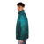 Puffer jacket featuring a glow-in-the-dark design of abstract tree silhouettes against a starry night sky - men side left